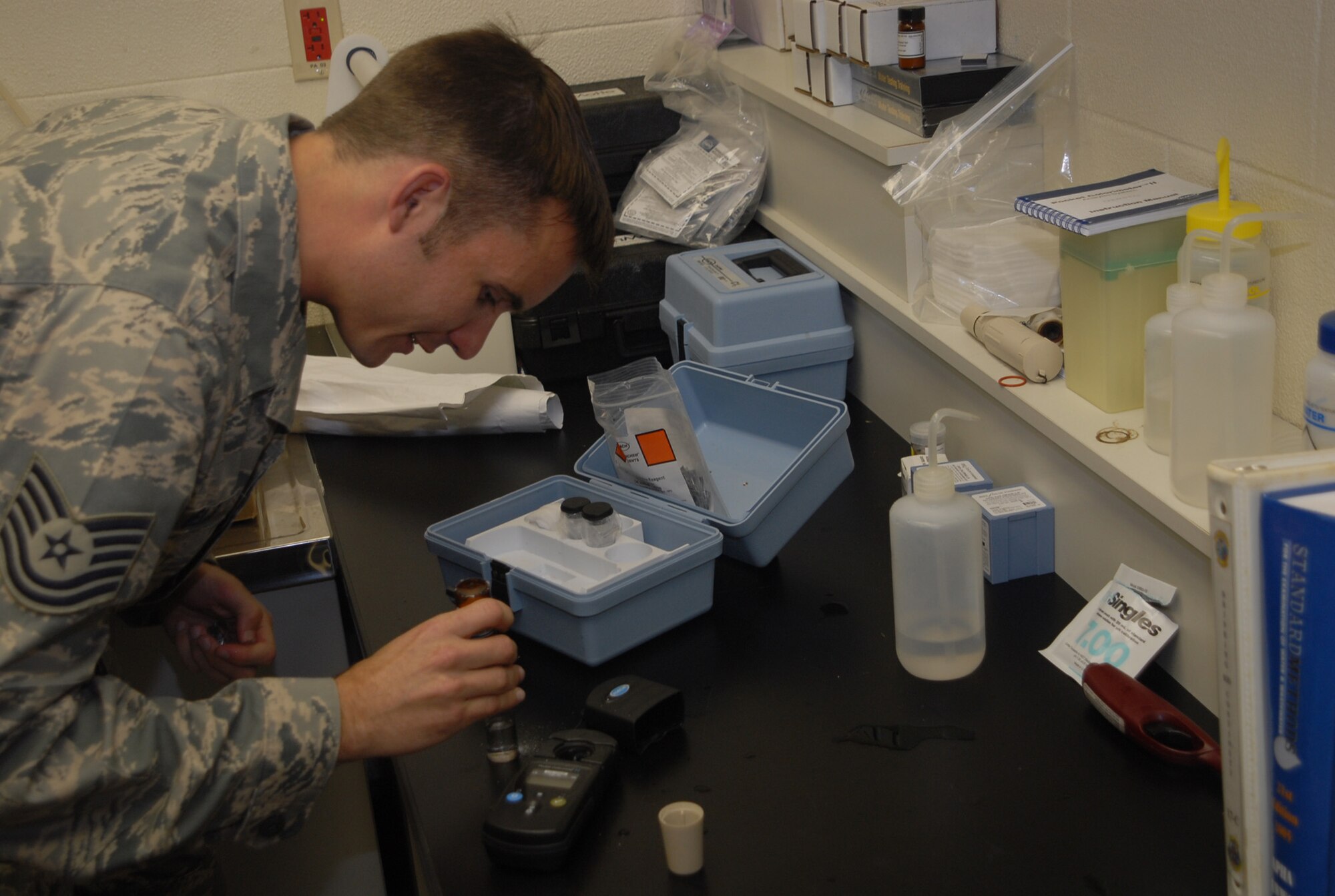 Tech. Sgt. Andrew Wells, 18th Aerospace Medical Squadron Bioenvironmental Engineering Flight technician, prepares water for PH testing to determine its safety for consumption Jan. 15.  Members of the Bioenvironmental Engineering Flight are responsible for testing 12 water systems on Okinawa for roughly 55,000 consumers. (U.S. Air Force/Staff Sgt. Christopher Marasky)