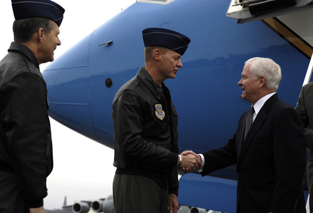 U.S. Air Force Col. John "Red" Millander, center, 437th Airlift Wing commander, and Col. Tim Wrighton, left, 315th Airlift Wing commander, greet  Defense Secretary Robert M. Gates upon his arrival at Charleston Air Force Base, S.C., Jan. 18, 2008.  
