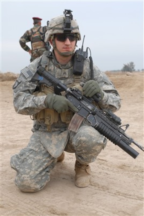 U.S. Army Sgt. Benjamin Biddle rests on his knee during a mission to clear insurgents from the Chaka Four region south of Baghdad, Iraq, on Jan. 10, 2008.  Biddle is attached the Army's Charlie Company, 2nd Battalion, 502nd Infantry Regiment, 2nd Brigade Combat Team, 101st Airborne Division.  