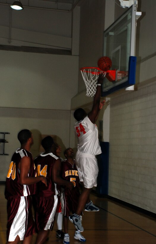 Sheppard Senator's player DeAndreas Crawford makes a layup against the Tinker Air Force Base Hawks Jan. 19 in the annual Dr. Martin Luther King Jr. Day tournament. The Senators defeated the Hawks, 86-73. (U.S. Air Force photo/Airman 1st Class Jacob Corbin)