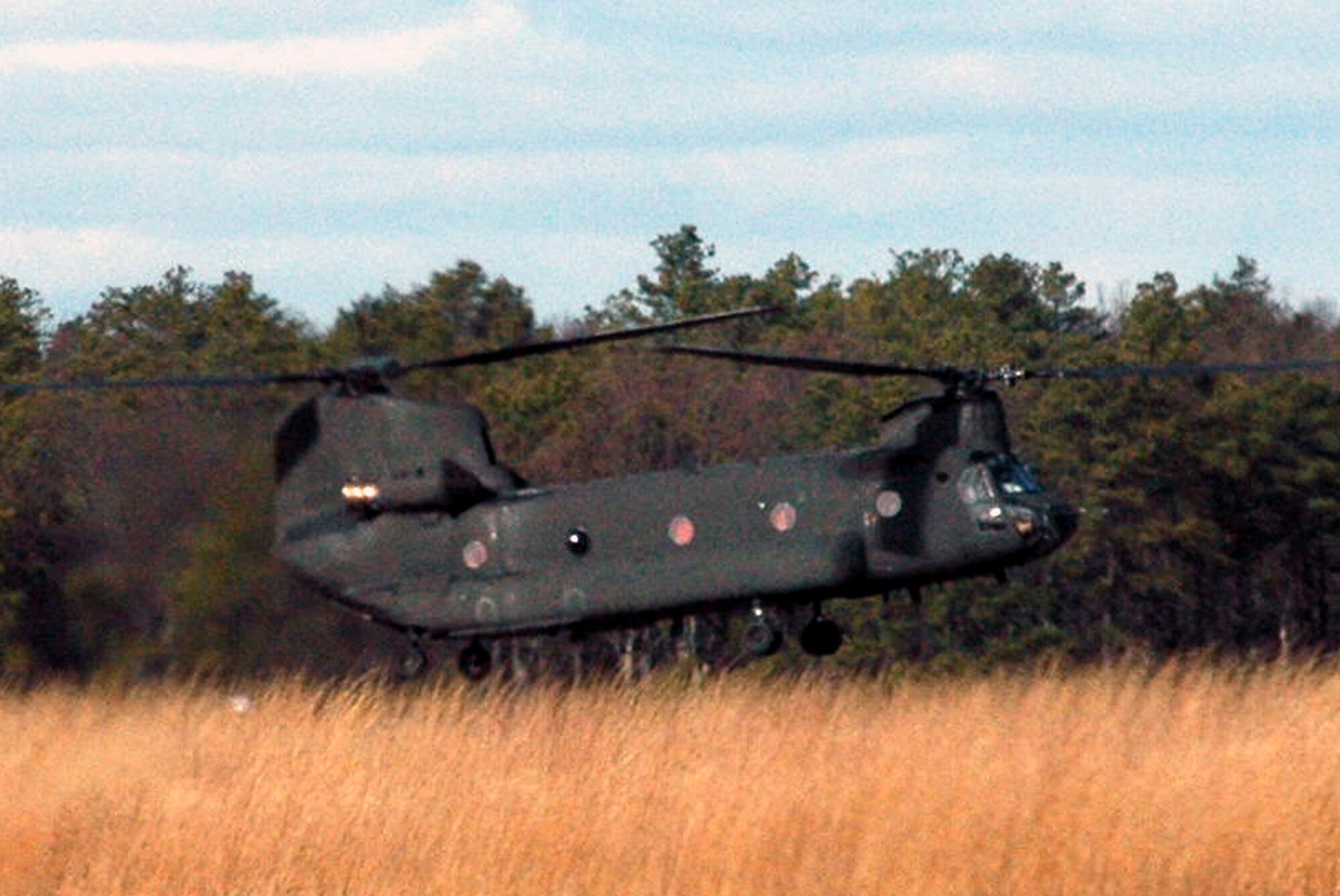 A CH-47 Chinook from Detachment 1, Company G, 104th Aviation Battalion of the Connecticut Army National Guard at Windsor Locks, prepares to land at Naval Air Engineering Station Lakehurst, N.J. as part of an event for Air Force Exercise Eagle Flag 08-2 Jan. 16.  The effort was part of a joint operations event for the exercise.  The exercise is operated by the U.S. Air Force Expeditionary Center's 421st Combat Training Squadron at Fort Dix, N.J.  (U.S. Air Force Photo/Tech. Sgt. Scott T. Sturkol)