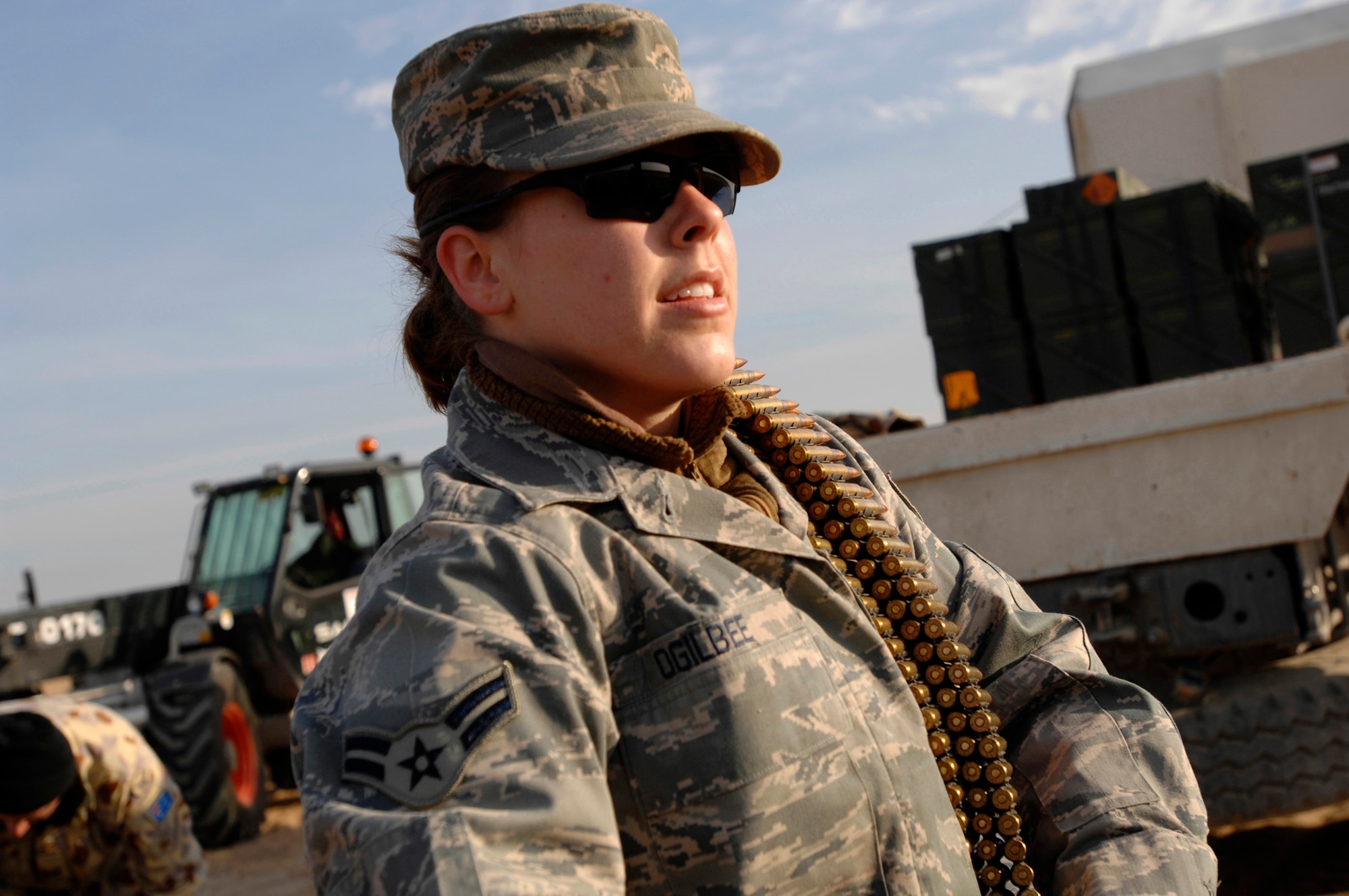 Airman 1st Class Jessica Ogilbee, 386th Expeditionary Civil Engineer Squadron explosive ordnance disposal flight, handles ammunition that is set to be destroyed during a controlled detonation with coalition forces from the Australian Army Force Level Logistic Asset Jan. 18 at an explosive ordnance disposal range in the Persian Gulf Region.  The controlled detonation is destroying unserviceable munitions.  (U.S. Air Force photo/Senior Airman Patrick Dixon) 