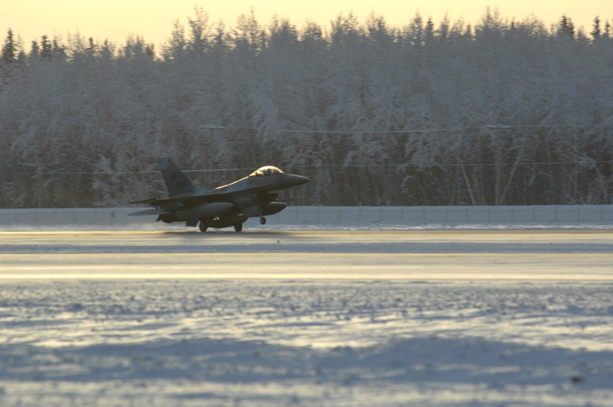 EIELSON AIR FORCE BASE, Alaska -- An F-16 Aggressor lands on Eielson's flight line for the very first time which will be used for training purposes in exercises such as Red Flag- Alaska Jan. 20, 2008.  About 40 F-16s fighters are being permanently swapped this week between the 354th Fighter Wing at Eielson Air Force Base, Alaska, and the 8th Fighter Wing at Kunsan Air Force Base, Korea, in an effort to put newer, more capable aircraft on the Korean peninsula. (U.S. Air Force photo by Airman 1st Class Christopher Griffin) (RELEASED)