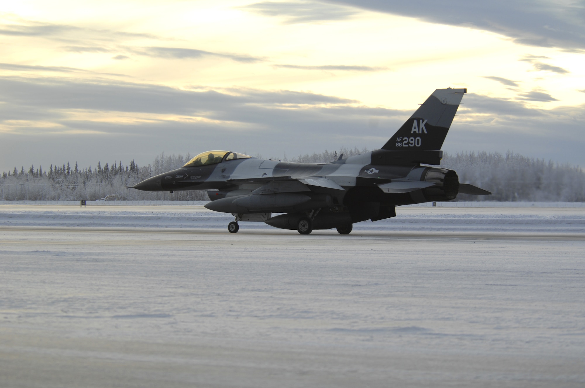 EIELSON AIR FORCE BASE, Alaska -- An F-16 Aggressor taxis down Eielson's flight line for the very first time which will be used for training purposes in exercises such as Red Flag- Alaska Jan. 20, 2008.  About 40 F-16s fighters are being permanently swapped this week between the 354th Fighter Wing at Eielson Air Force Base, Alaska, and the 80th Fighter Wing at Kunsan Air Force Base, Korea, in an effort to put newer, more capable aircraft on the Korean peninsula. (U.S. Air Force photo by Airman 1st Class Christopher Griffin) (RELEASED)