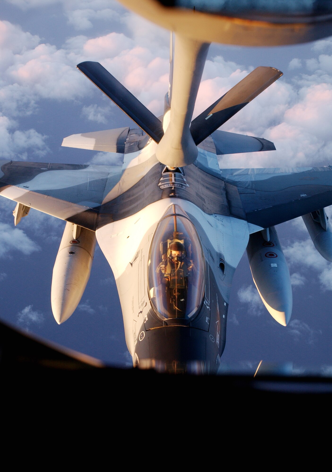 An F-16 Fighter jet with Artic Flanker paint scheme is refueled during its flight from Kunsan Air Base, Korea to its new home, Eielson Air Force Base, Alaska on January 20, 2008.  Eielson AFB and Kunsan Air Base swapped seven F-16 jets as a part of the Common Configuration Implementation Program (CCIP). 

(U.S. Air Force photo by: Staff Sgt. Eric T. Sheler)

