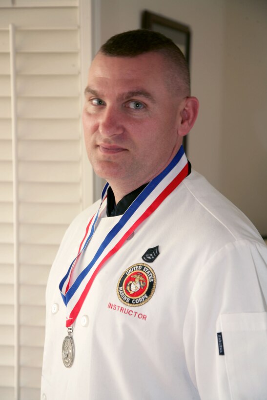 Gunnery Sgt. Thomas Millican shows off the silver medal he won at the 33rd Annual U.S. Army Culinary Arts Competition, an inter-service culinary competition.