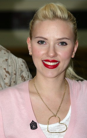 Scarlett Johansson smiles after being pinned with gunnery sergeant rank during a meet and greet Jan. 20 in the United Service Organizations building at Camp Buehring, Kuwait. The 23-year-old bombshell met with nearly 600 service members at Camp Buehring, Kuwait Jan. 20 during her five-day United Service Organizations (USO) tour to the Gulf region