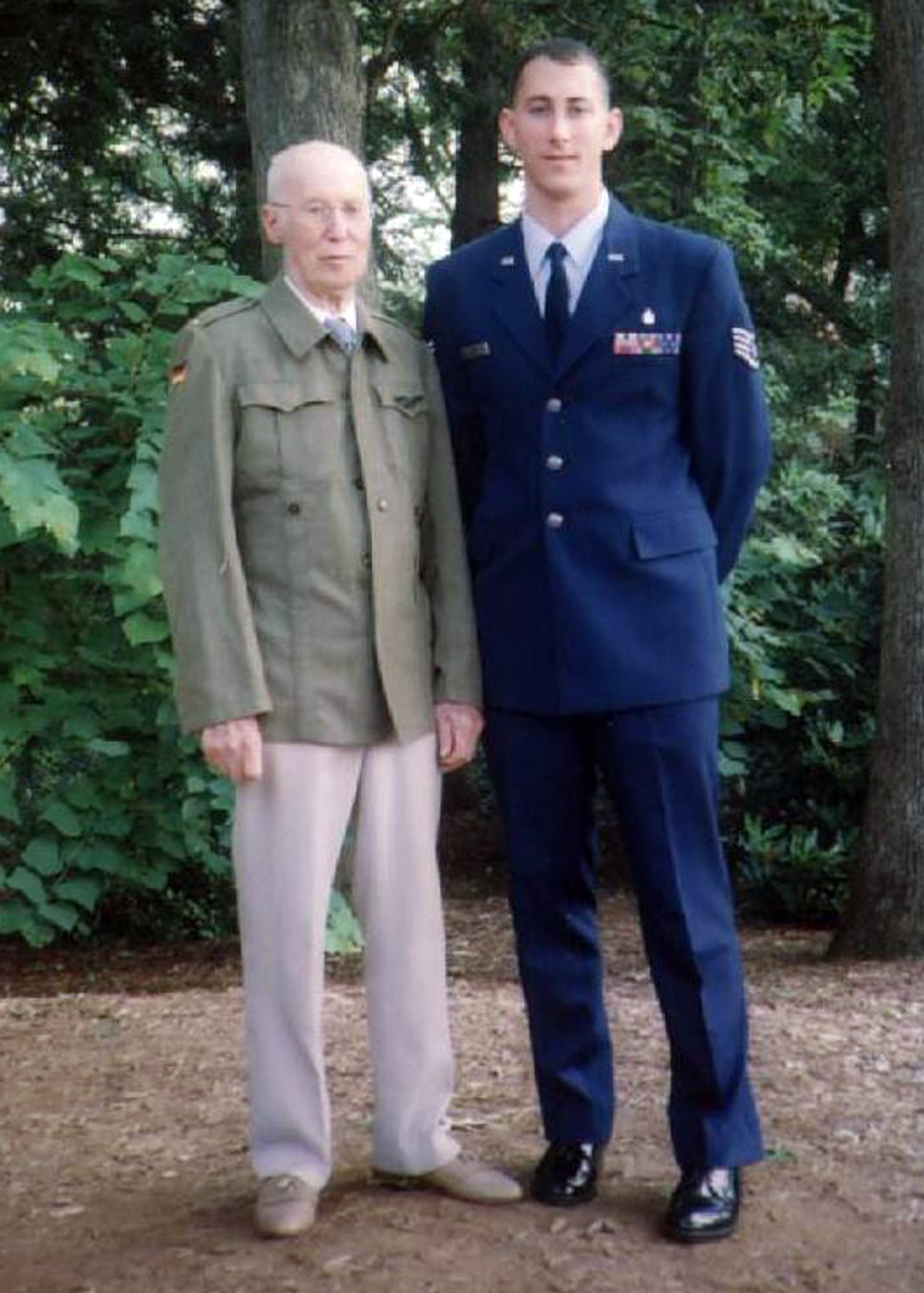 FORT BRAGG, N.C. - Now a captain, former Staff Sgt. Trevor Ambron shares a moment with his grandfather, Richard Kozlowski. Former U.S. Army Air Corps Capt. Kozlowski piloted B-17 combat missions over Germany during World War II. The younger Captain Ambron promised his grandfather he would someday be a captain himself, just like his grandfather. On Jan 14, 2008, he fulfilled that promise. (Photo courtesy of Capt. Trevor Ambron)