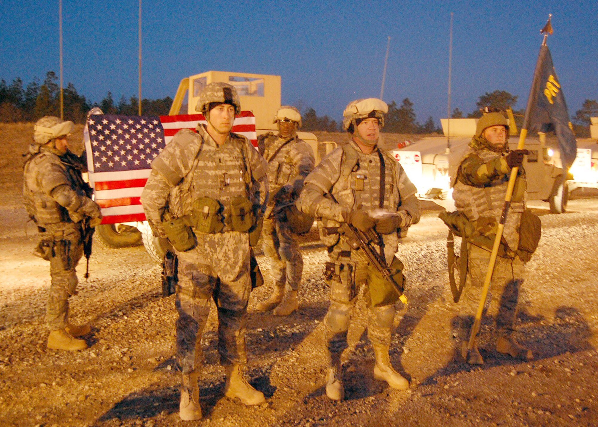 FORT BRAGG, N.C. - Left to right, Tech. Sgt. John Natoli, Capt. Trevor Ambron, Tech. Sgt. Wendell Snider, Lt. Col. Brett Sharp, and Senior Airman Dave Thomas stand before the Provincial Reconstruction Team Gardez formation to promote Captain Ambron to his current rank. Captain Ambron deployed from Shaw Air Force Base, S.C., to serve as Provincial Reconstruction Team Gardez’ Physician Assistant. PRT Gardez will deploy to Afghanistan early this spring for a year in Afghanistan. (U.S. Air Force photo/Capt. Ken Hall)
