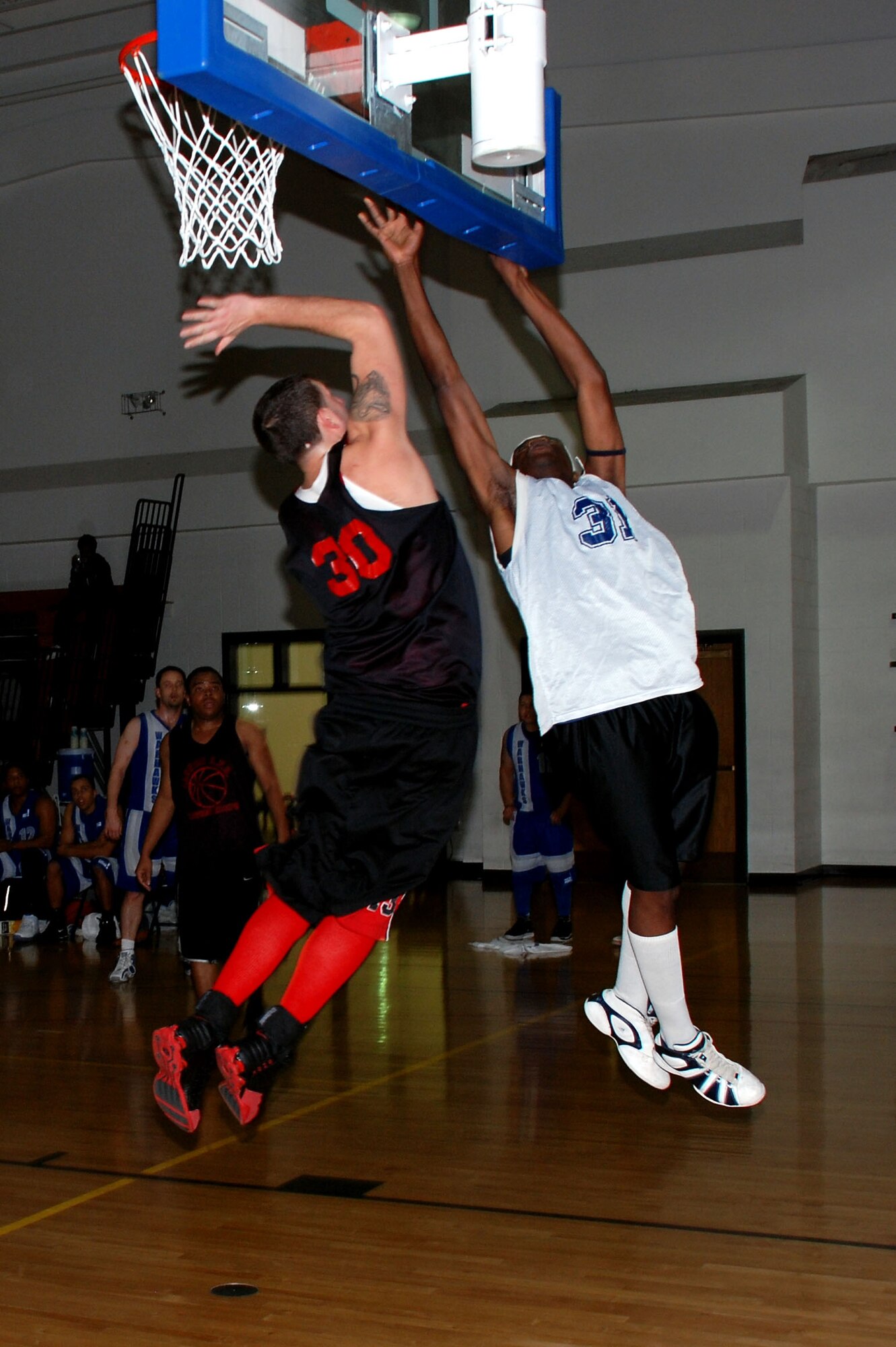 Jerry Williams, 30, of the Cannon Air Force Base Warriors defends a lay up attempt by Lackland Air Force Base Warhawk Ezell Trammell during the 14th Annual Dr. Martin Luther King Jr. basketball tournament Jan. 21 at the Pitsenbarger Fitness Center. Lackland beat Cannon twice - 76-50 and 99-79 - to claim the championship. (U.S. Air Force photo/Airman 1st Class Jacob Corbin)