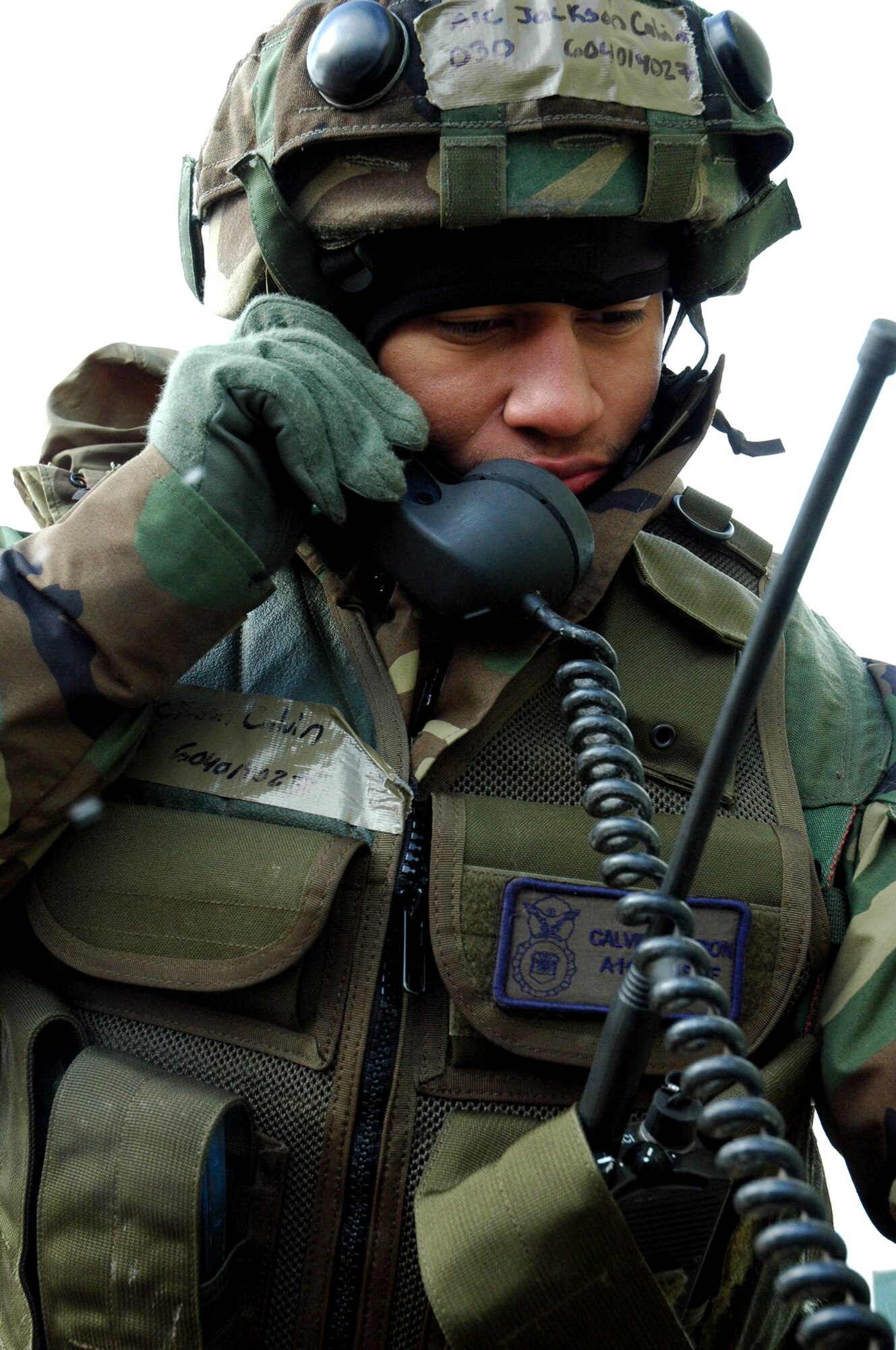 Airman 1st Class Jackson Calvin, security forces Airman from the 60th Security Forces Squadron, Travis Air Force Base, Calif., calls on a field phone during operations for Air Force Exercise Eagle Flag 08-2 Jan. 20 at Naval Air Engineering Station Lakehurst, N.J.  Airman Calvin was supporting the 570th Contingency Response Group -- also from Travis.  The exercise is operated by the U.S. Air Force Expeditionary Center's Expeditionary Operations School and 421st Combat Training Squadron at Fort Dix, N.J.  (U.S. Air Force Photo/Tech. Sgt. Scott T. Sturkol)