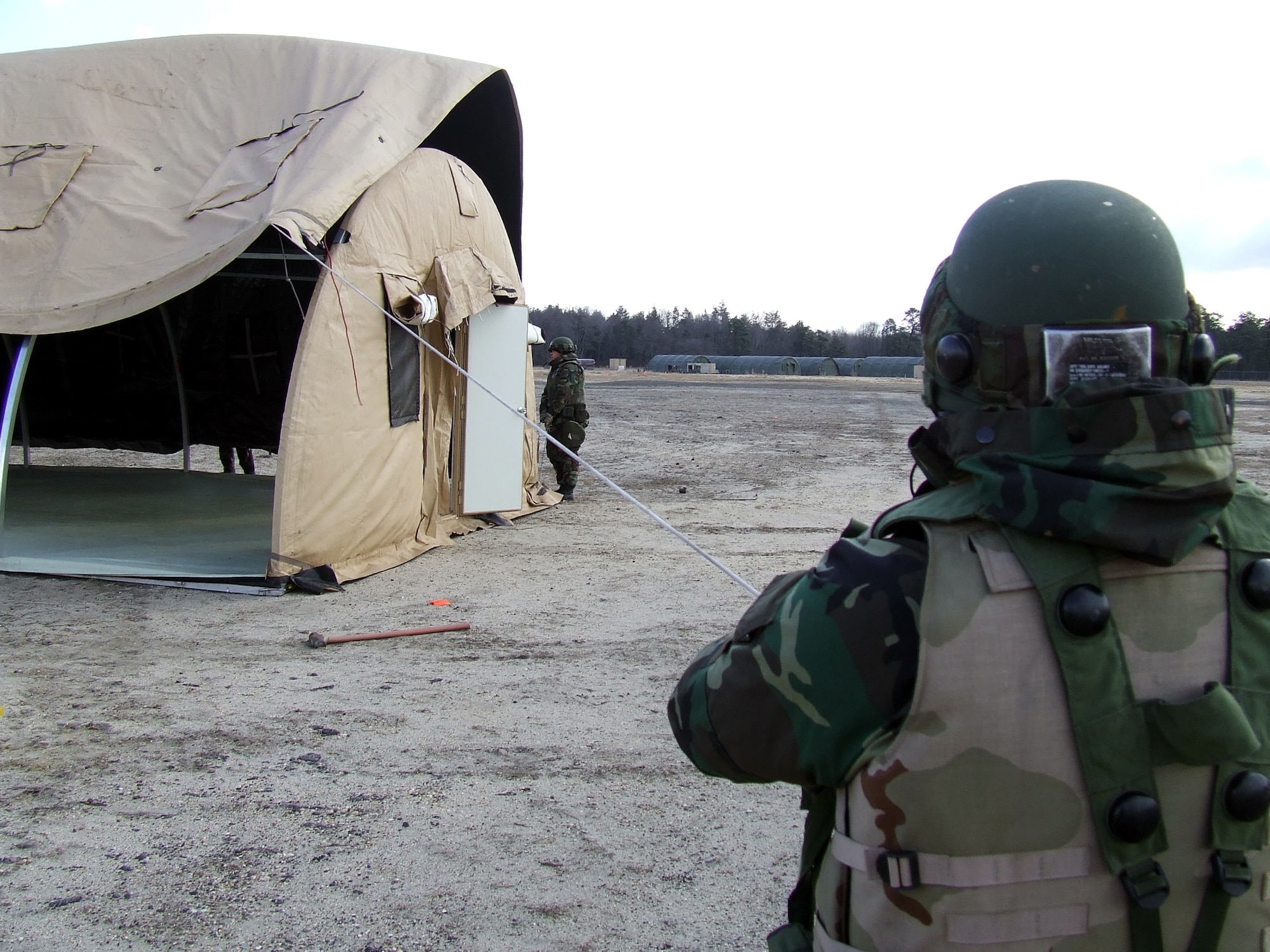 Airmen work on assembling a tent during operations for Air Force Exercise Eagle Flag 08-2 at Naval Air Engineering Station Lakehurst, N.J., Jan. 20.  Nearly 400 Airmen participate in the exercise.  The exercise is operated by the U.S. Air Force Expeditionary Center's Expedtionary Operations School and 421st Combat Training Squadron from Fort Dix, N.J.  (U.S. Air Force Photo/Tech. Sgt. Scott T. Sturkol)
