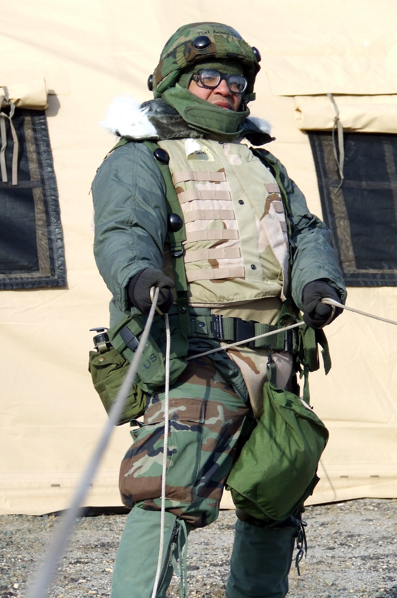Tech. Sgt. Antonio Smith, Vance Air Force Base, Okla., pulls on a rope while assembling a tent during operations for Air Force Exercise Eagle Flag 08-2 at Naval Air Engineering Station Lakehurst, N.J., Jan. 20.  Sergeant Smith is one of nearly 400 Airmen participating in the exercise.  The exercise is operated by the U.S. Air Force Expeditionary Center's Expedtionary Operations School and 421st Combat Training Squadron from Fort Dix, N.J.  (U.S. Air Force Photo/Tech. Sgt. Scott T. Sturkol)