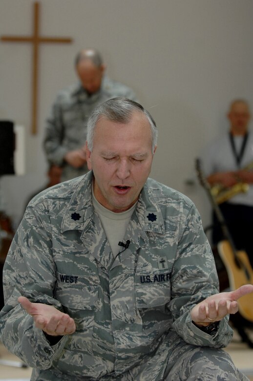 BALAD AIR BASE, Iraq -- Lt. Col. Steve West, 332nd Air Expeditionary Wing chaplain, leads prayer before giving his sermon Jan. 20. Chaplain West is deployed from Whiteman Air Force Base, Mo. (U.S. Air Force photo/Senior Airman Julianne Showalter)