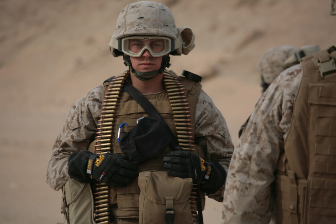 CAMP BUEHRING, Kuwait (Jan. 21, 2008) ? A Marine from Combat Logistics Battalion 11, 11th Marine Expeditionary Unit, Camp Pendleton, Calif., prepares to shoot an M240G Medium Machine Gun during a weapons firing exercise at the Udairi Range Complex here. CLB-11 is the MEU?s combat logistics element and comprised of a headquarters element and personnel from supply, military police, transportation support, engineers, maintenance and health services detachments. Their purpose is to support all the elements of the 11th MEU in accomplishing their missions and to serve as the lead force ashore during humanitarian assistance, evacuation control center, and mass casualty response team missions. The 11th MEU is conducting sustainment training in Kuwait as part of their scheduled six-month deployment through the Western Pacific Ocean and Arabian Gulf region.