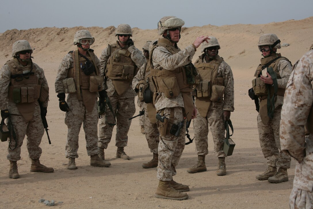 CAMP BUEHRING, Kuwait (Jan. 21, 2008) ?  Staff Sgt. Nathaniel J. Knuckles, Combat Logistics Battalion 11, 11th Marine Expeditionary Unit, Camp Pendleton, Calif., gives instructions to Marines prior  at the Udairi Range Complex during a weapons shoot here. CLB-11 is the MEU?s combat logistics element and comprised of a headquarters element and personnel from supply, military police, transportation support, engineers, maintenance and health services detachments. Their purpose is to support all the elements of the 11th MEU in accomplishing their missions and to serve as the lead force ashore during humanitarian assistance, evacuation control center, and mass casualty response team missions. The 11th MEU is conducting sustainment training in Kuwait as part of their scheduled six-month deployment through the Western Pacific Ocean and Arabian Gulf region.