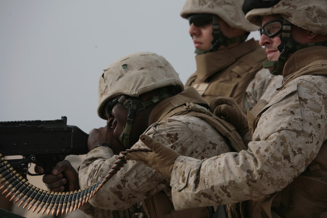 CAMP BUEHRING, Kuwait (Jan. 21, 2008) ? Marines from Combat Logistics Battalion 11, 11th Marine Expeditionary Unit, Camp Pendleton, Calif., prepare to shoot an M240G Medium Machine Gun during a weapons firing exercise at the Udairi Range Complex here. CLB-11 is the MEU?s combat logistics element and comprised of a headquarters element and personnel from supply, military police, transportation support, engineers, maintenance and health services detachments. Their purpose is to support all the elements of the 11th MEU in accomplishing their missions and to serve as the lead force ashore during humanitarian assistance, evacuation control center, and mass casualty response team missions. The 11th MEU is conducting sustainment training in Kuwait as part of their scheduled six-month deployment through the Western Pacific Ocean and Arabian Gulf region.