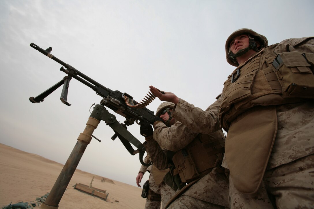 CAMP BUEHRING, Kuwait (Jan. 21, 2008) ? Marines from Combat Logistics Battalion 11, 11th Marine Expeditionary Unit, Camp Pendleton, Calif., fire an M240G Medium Machine Gun during a weapons firing exercise at the Udairi Range Complex here. CLB-11 is the MEU?s combat logistics element and comprised of a headquarters element and personnel from supply, military police, transportation support, engineers, maintenance and health services detachments. Their purpose is to support all the elements of the 11th MEU in accomplishing their missions and to serve as the lead force ashore during humanitarian assistance, evacuation control center, and mass casualty response team missions. The 11th MEU is conducting sustainment training in Kuwait as part of their scheduled six-month deployment through the Western Pacific Ocean and Arabian Gulf region.