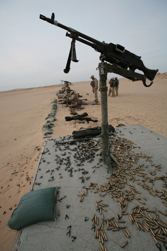 CAMP BUEHRING, Kuwait (Jan. 21, 2008) ? Marines from Combat Logistics Battalion 11, 11th Marine Expeditionary Unit, Camp Pendleton, Calif., prepare to shoot an M240G Medium Machine Gun during a weapons firing exercise at the Udairi Range Complex here. CLB-11 is the MEU?s combat logistics element and comprised of a headquarters element and personnel from supply, military police, transportation support, engineers, maintenance and health services detachments. Their purpose is to support all the elements of the 11th MEU in accomplishing their missions and to serve as the lead force ashore during humanitarian assistance, evacuation control center, and mass casualty response team missions. The 11th MEU is conducting sustainment training in Kuwait as part of their scheduled six-month deployment through the Western Pacific Ocean and Arabian Gulf region.