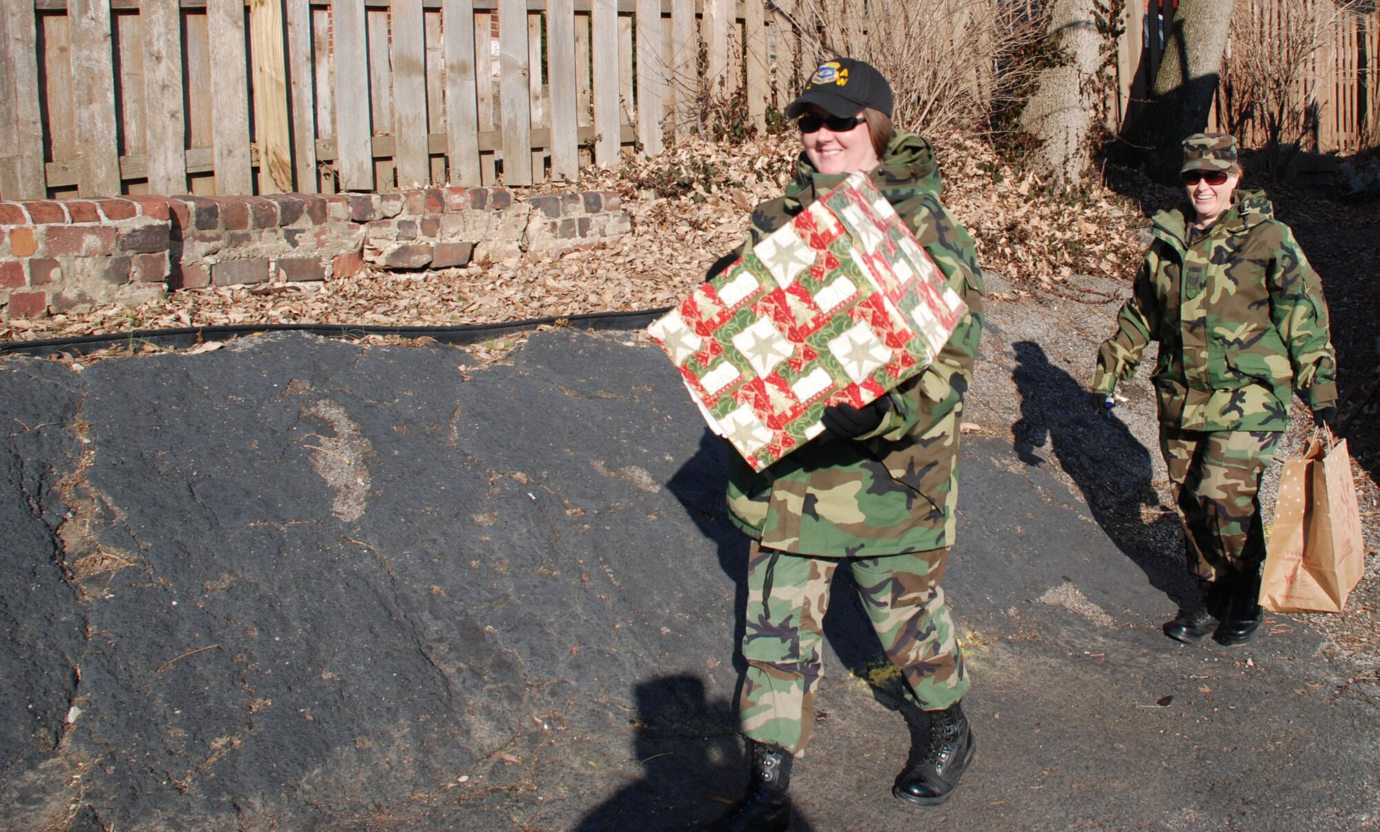 Members of the Air Force Reserve Command's Illinois flying wing, the 932nd Airlift Wing donate warm hats and gloves to a local women's shelter. 