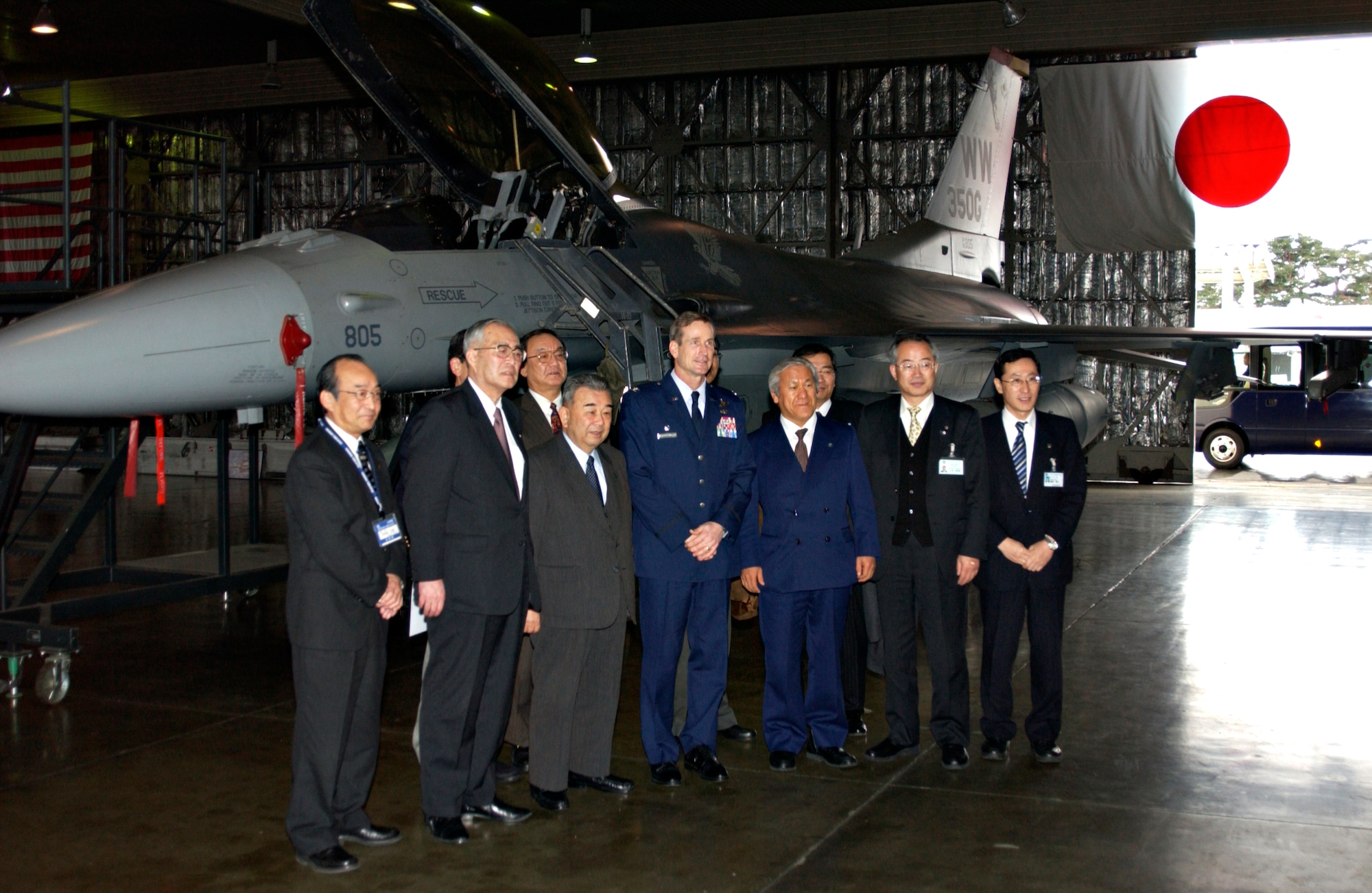 MISAWA AIR BASE, Japan -- The Liaison Comittee gather to see an F-16 on display at Hangar 911 as part of their annual visit to Misawa on Jan. 22, 2008. The committee meets annually to exchange ideas, issues, and ensure that the relationship between Misawa Air Base and Japan continues to grow. (U.S. Air Force photo by Airman 1st Class Eric Harris)