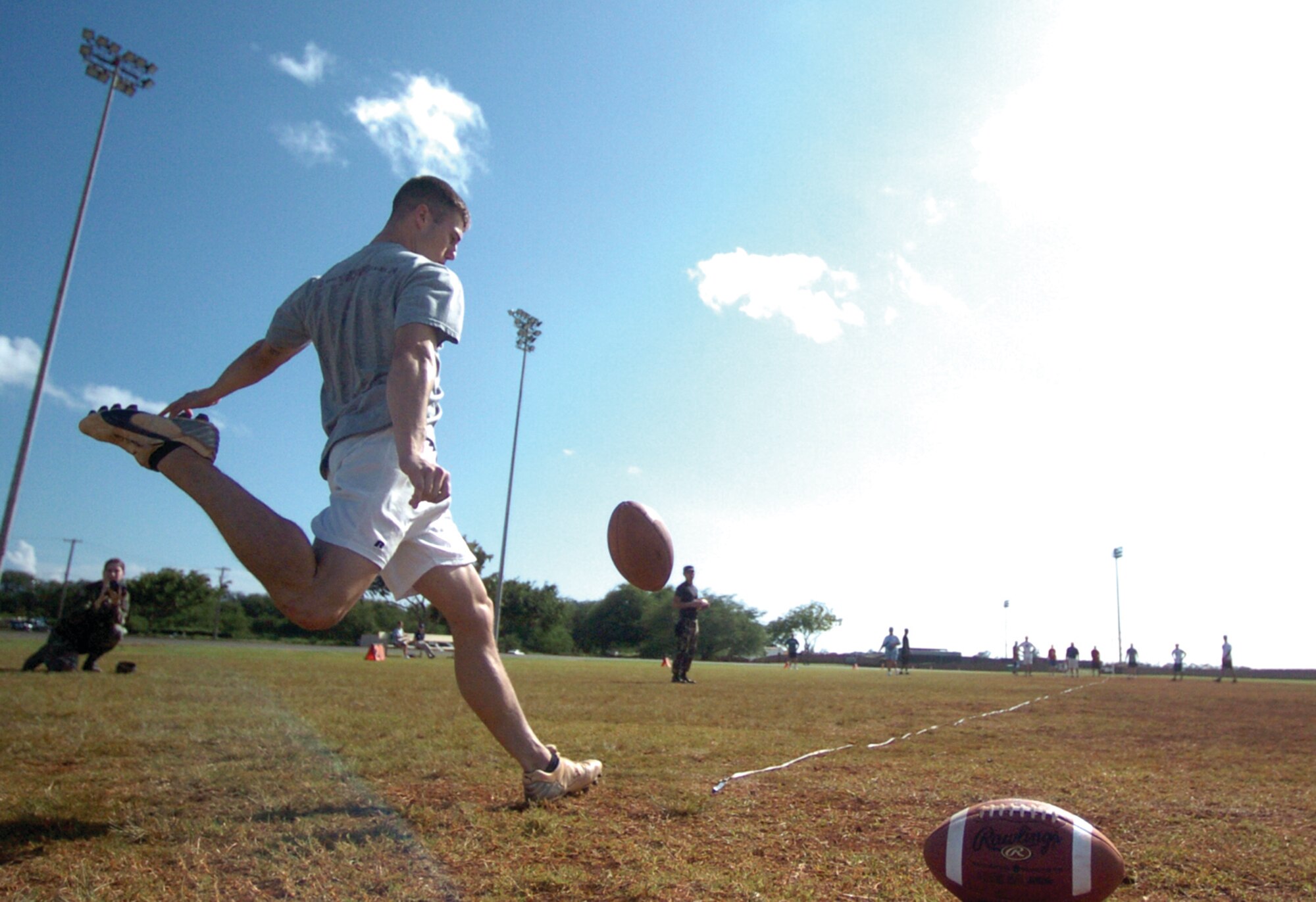 Team Hickam booter Richard Good, last year’s National Football League-sponsored military challenge definition of upright perfection, will defend his personal field goal crown in two weeks at Kapiolani Park. While New England’s pursuit of a third Superbowl in five years is impressive, it pails in comparison to the Air Force’s chance to be the back-to-back-to-back NFL challenge champs. Island teams representing the Army, Coat Guard, Marines and Navy are scheduled to keep the AF from achieving three-peat perfection. A team profile will appear in next week’s Kukini. For more information, contact the base fitness center at 448-4640. Photo by Mark Munsey