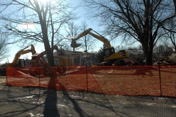 WHITEMAN AIR FORCE BASE, Mo. - Construction workers from Reasback Construction Inc. tear down houses located on Barksdale Lane Jan. 22. The houses are being torn down to provide more space for future development. (Air Force photo/ Airman 1st Class Cory Todd)
