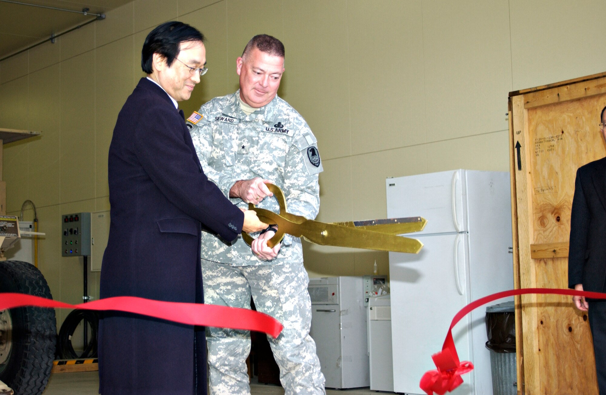 MISAWA AIR BASE, Japan -- Army Brig.Gen. J.E. Seward and Mr. Koji Haneda, Ministry of Foreign Affairs, Tokyo, cut the ribbon for the official opening of JTAGS Misawa on Jan. 22, 2008. Misawa Air Base was selected for its ability to support operations, soldiers and their families. (U.S. Air Force photo by Airman 1st Class Eric Harris)
