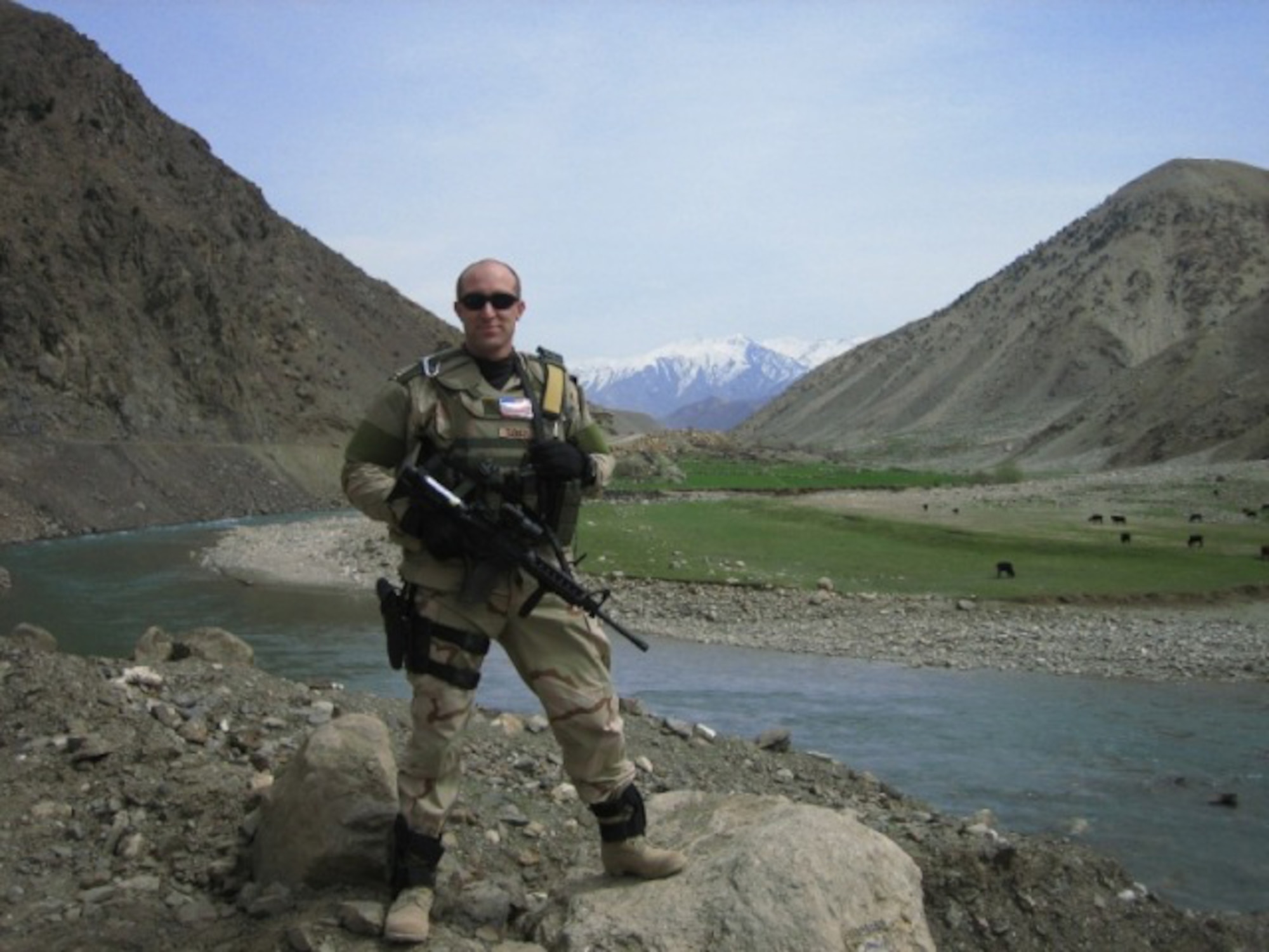 1st Lt. TJ Turner, a member of the 455th Expeditionary Mission Support Group is shown wearing TRON I on his left shoulder.  Air Force Research Laboratory partnered with industry to develop the identification system to save lives and enhance combat effectiveness. (U.S. Air Force photo)