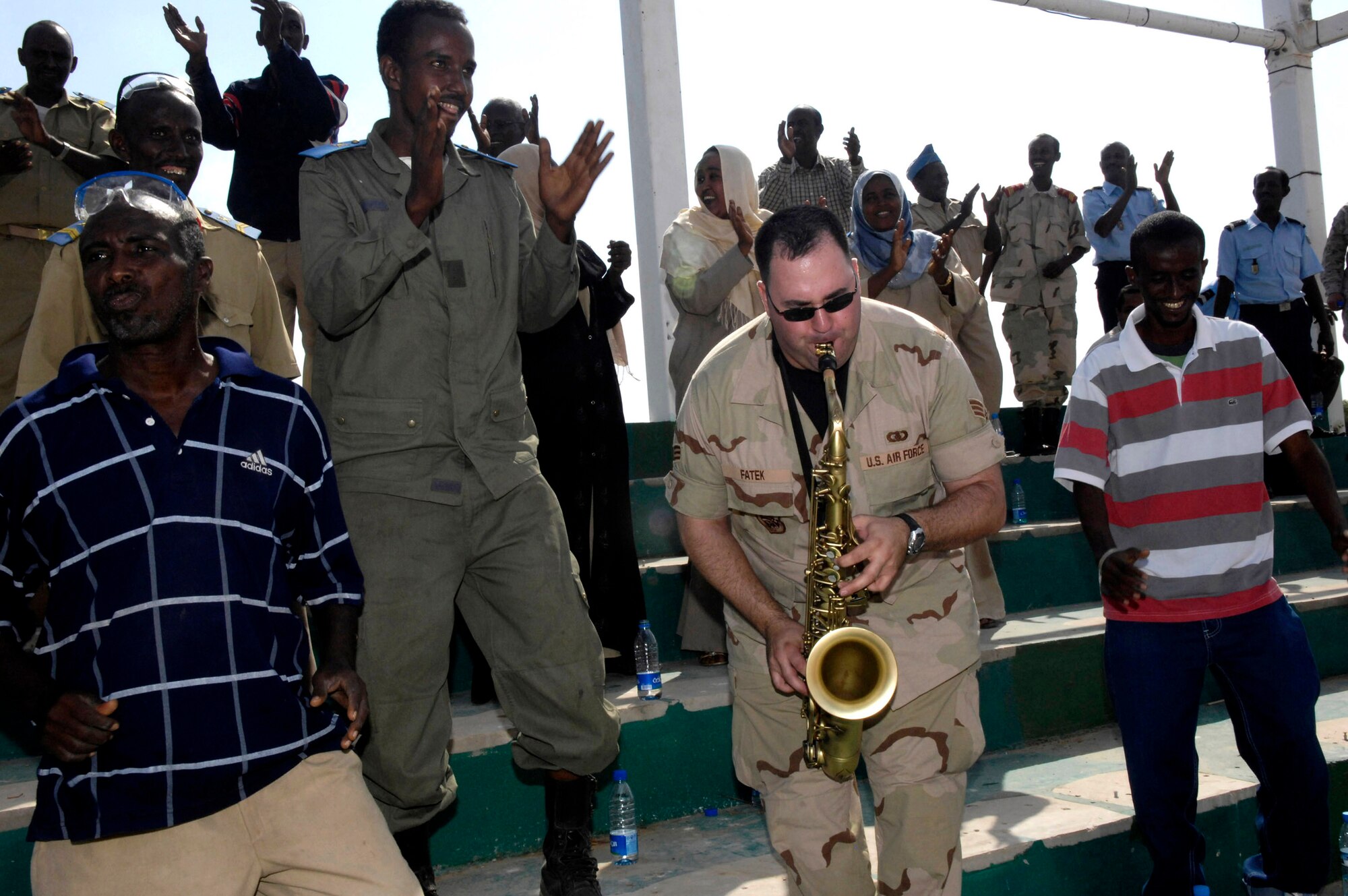 Senior Airman David Fatek performs for the Djibuti national police academy Jan. 22. The U.S. Central Command Air Forces Band Live Round will be performing eight shows in five days in Africa for the base and the local community. Airman Fatek is a U.S. Central Command Air Forces Band member. (U.S. Air Force photo/Staff Sgt. Christina M. Styer) 
