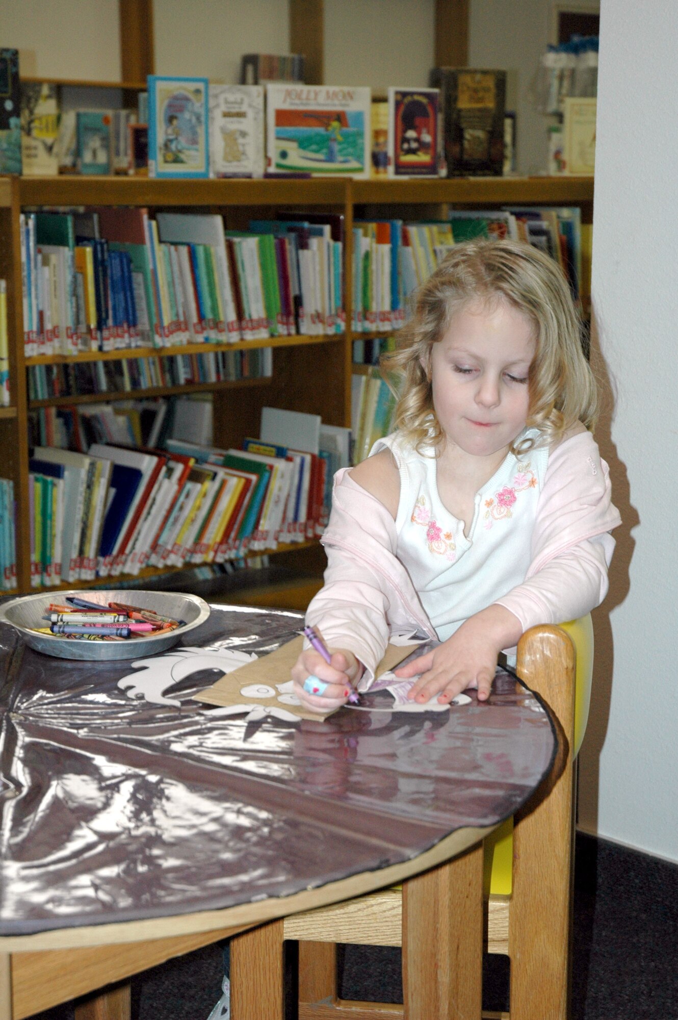 Little Warrior Lauren, 4, colors her owl-themed craft project Jan. 22 at the Arden G. Hill Memorial Library. Each Tuesday at 10 a.m., the library holds storytime and the children create craft projects that coincide with the day’s reading theme. Check out other library events at www.341services.com/library. (U.S. Air Force photo/Senior Airman Eydie Sakura)