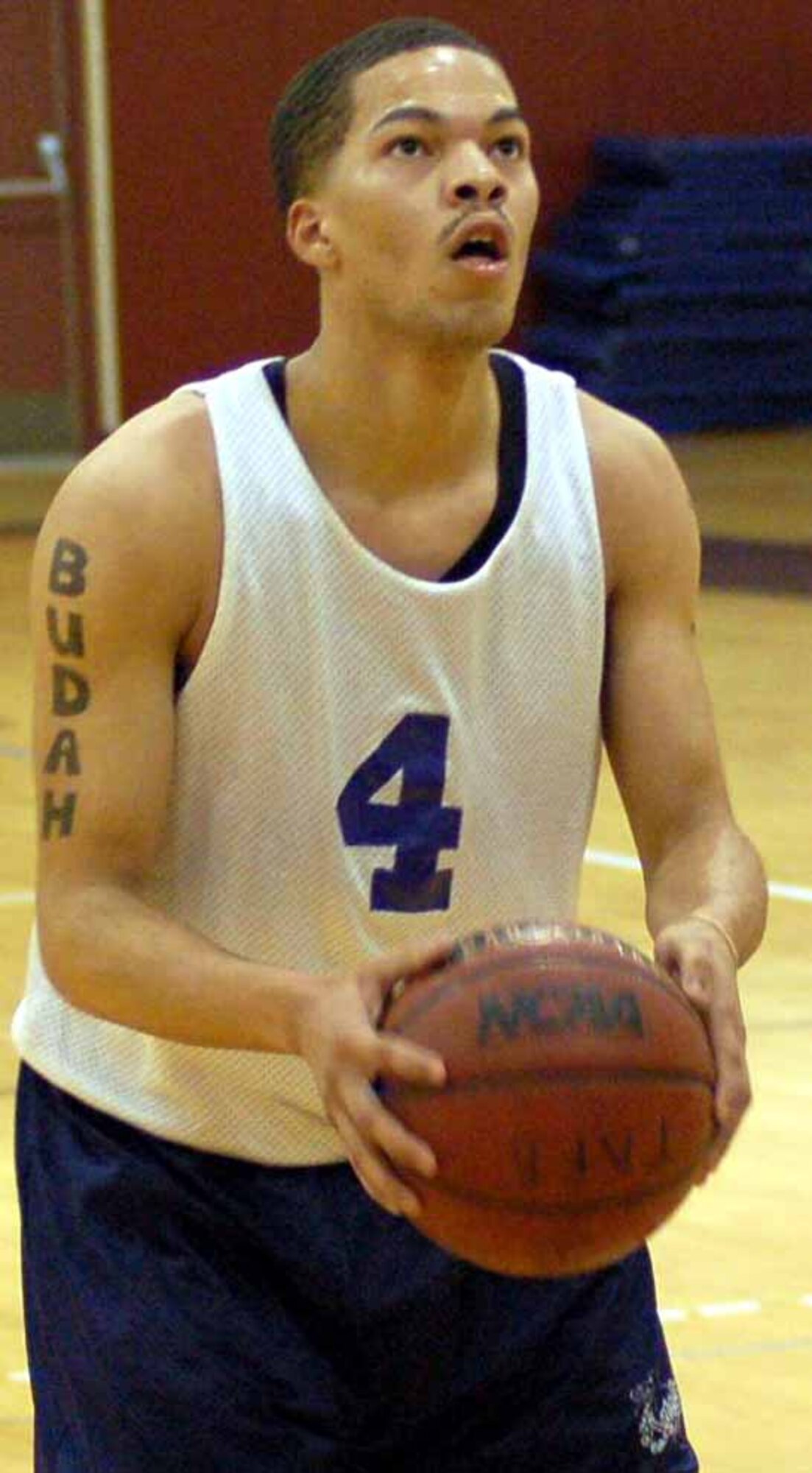 Guard Harley Shannon, 552nd Operational Support Squadron, prepares for a foul shot in the second half of a Jan. 16 game against the 552nd Aircraft Maintenance Squadron. The 552nd OSS won the game 42-40.