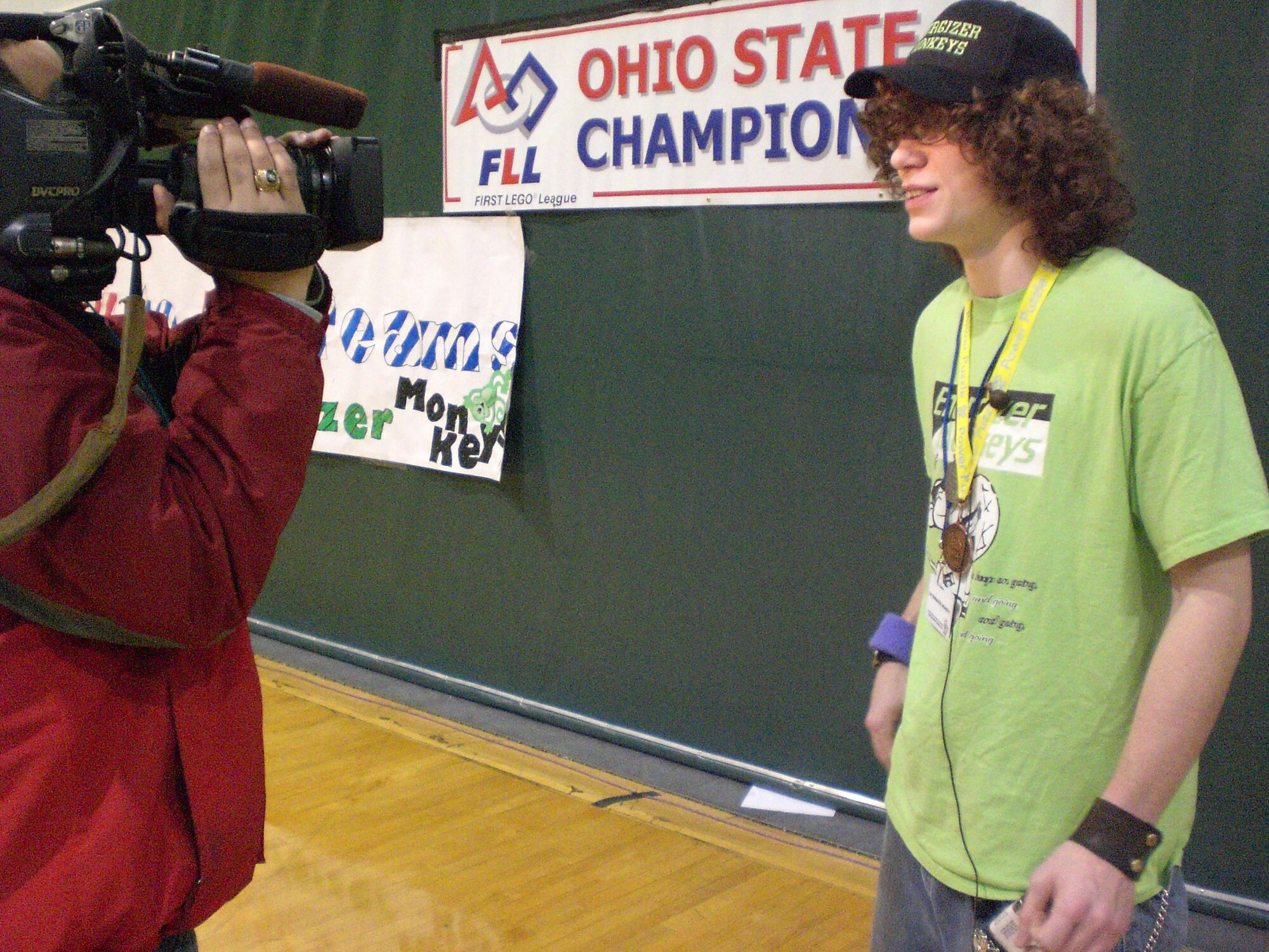 Justin Von Wahlde, of the Energizer Monkeys team, is interviewed by Dayton media during the FIRST LEGO League Ohio State Robotics Championship Jan. 13 at Wright State University.  Von Wahlde, a sophmore from Reading Junior - Senior High School, Ohio, was singled out as top Youth Coach/Mentor during the event. (U.S. Air Force photo/Derek Kaufman)
