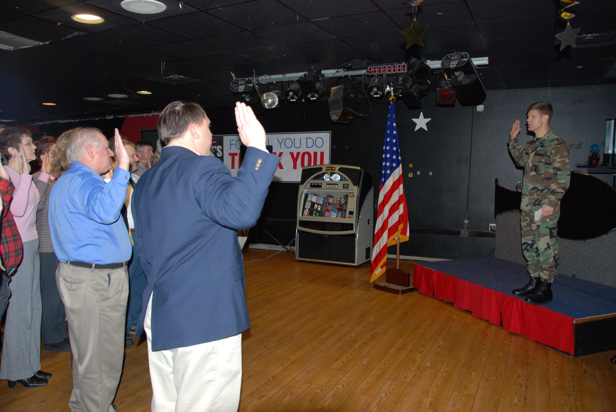 EIELSON AIR FORCE BASE, Alaska--Brig. Gen. Mark Graper, 354th Fighter Wing commander, conducts the Oath of Office during a reaffirmation ceremony for Eielson's civilian workers Jan. 17 at the Yukon Club. Many civilian workers are prior military and swore their oaths every enlistment; as civil servants, the employees signed statements upon hire, and are taking their Oath of Office as a reminder of their commitment. (U.S. Air Force photo by Airman 1st Class Nora Anton)