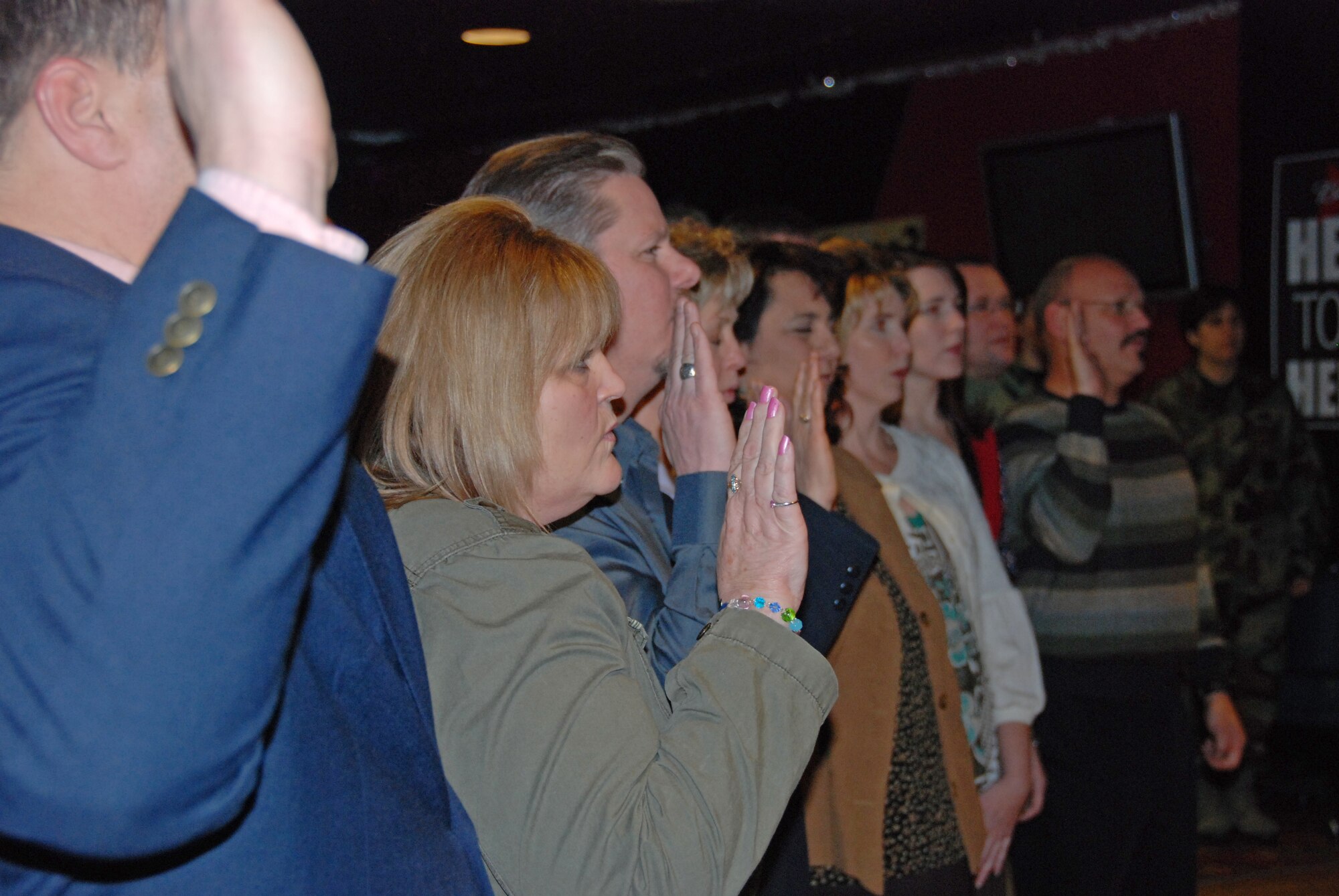 EIELSON AIR FORCE BASE, Alaska--Civilian contractors of the 354th Fighter Wing reaffirm their oath of office during a ceremony Jan. 17 at the Yukon Club. The civilians reaffirmed their oath as a reminder to themselves that they chose a career path to serve the American public as federal civil servends charged with supporting and defending the constitution of the U.S. (U.S. Air Force photo by Airman 1st Class Nora Anton)