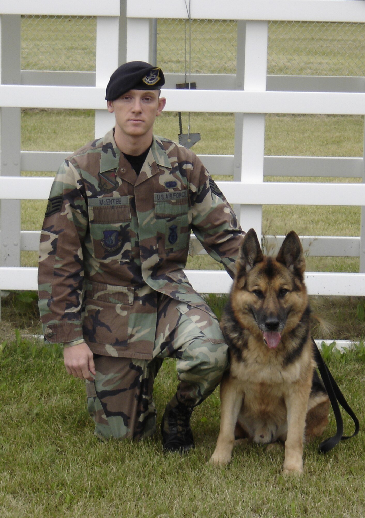 EIELSON AIR FORCE BASE, Alaska--Staff Sgt. Timothy McEntee, former 354th Security Forces Squadron military working dog handler currently stationed at Dyess AFB, Texas, poses for an official photo with Sorbon A333 while he was his dog handler. Sergeant McEntee adopted Sorbon Jan. 11 and he came to live with Sergeant McEntee and his wife. (stock photo)