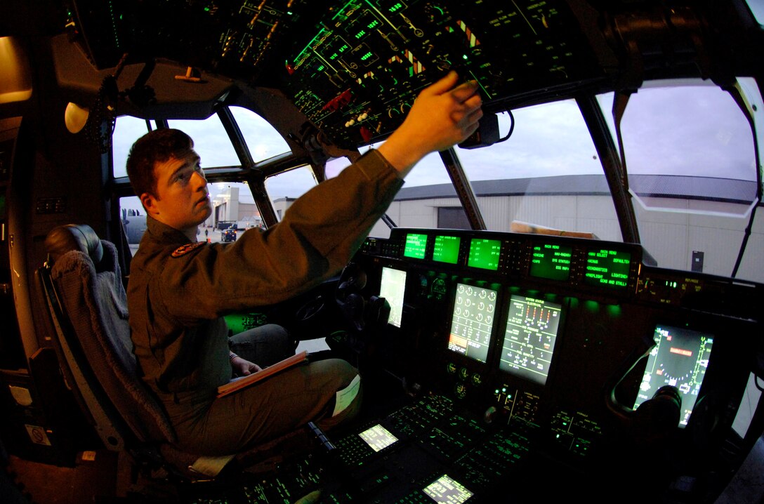 Staff Sgt. Joseph Maker performs preflight start-up on a C-130 Hercules an hour before departure Jan. 9 at Ramstein Air Base, Germany. Sergeant Maker is a loadmaster from the 143rd Airlift Wing at Quanset State Airport in Rhode Island. (U.S. Air Force photo/Master Sgt. Scott Wagers) 

