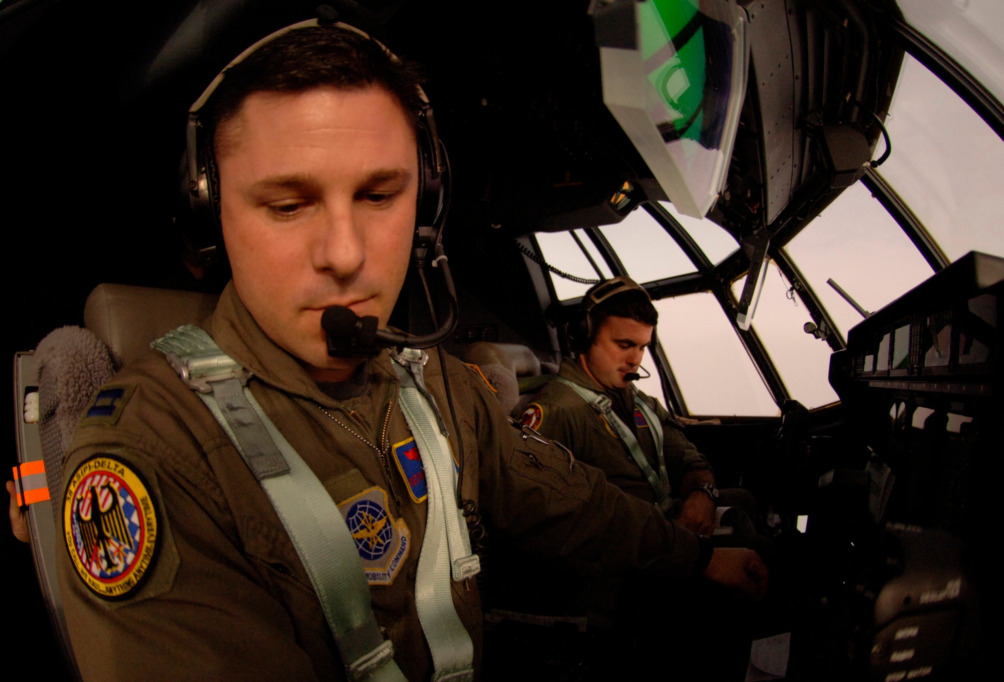 Capt. Kevin McDonnell reads a map while on board a C-130 Hercules Jan. 9 while enroute to Aviano Air Base, Italy. He is a Rhode Island Air National Guard C-130 co-pilot on temporary duty to the 38th Airlift Squadron at Ramstein Air Base, Germany. (U.S. Air Force photo/Master Sgt. Scott Wagers) 
