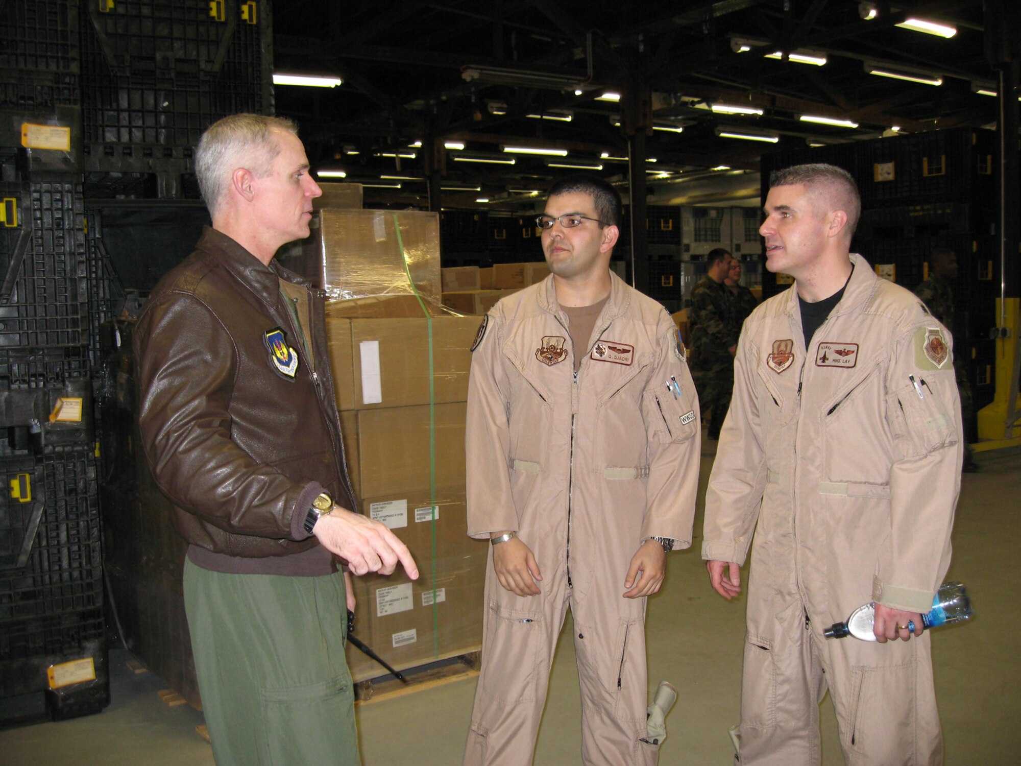SPANGDAHLEM AIR BASE, Germany – Col. Thomas Lawhead, 52nd Operations Group commander, wishes Capt. Quaid Quadri and Lt. Col. Mike Lay a safe deployment. Captain Quadri and Colonel Lay are deploying from the 23rd Fighter Squadron in support of Operation Iraqi Freedom Jan. 18, 2008. (U.S. Air Force photo/Staff Sgt. Tammie Moore)