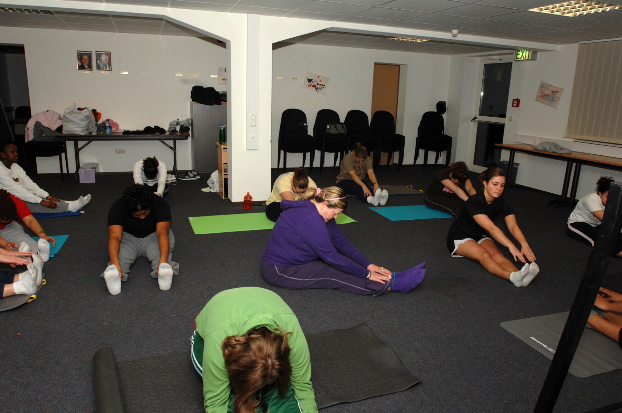 SPANGDAHLEM AIR BASE, Germany -- Women of the Protestant Women of the Chapel stretch before beginning the Christian Alternative to Yoga Class Jan.17, 2008. While doing yoga the women listen to various bible verses and practice proper breathing in order to relax, gain strength and flexibility. (U.S. Air Force photo/Airman 1st Class Jenifer Calhoun)