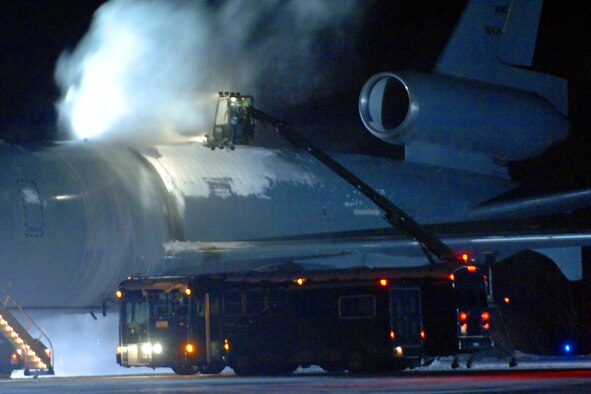 MISAWA AIR BASE, Japan -- Members of the Transient Alert Team de-ice a KC-10 on the flightline here Jan. 21, 2008. The KC-10 was here to support a group of F-16 Fighting Falcons heading to Eglin Air Force Base, Fla., for exercise Combat Hammer. (U.S. Air Force photo by Chief Master Sgt. Michael Atkinson)