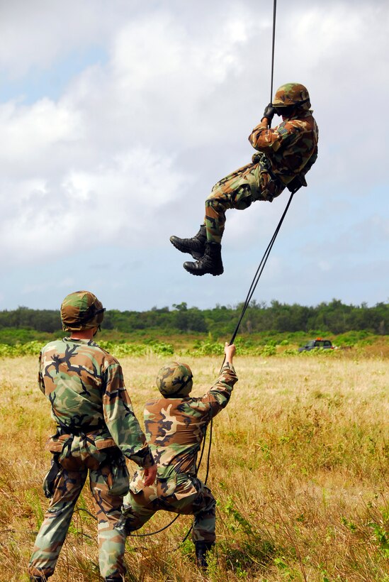 Capt. Brian Ellis, a member of the 554th RED HORSE Air Assault team, monitors a member of his team belaying during the air insertion training. The 554th RED HORSE Squadron's Air Assault team constantly trains for a variety of deployable situations. (U.S. Air Force photo/Airman 1st Class Daniel Owen)