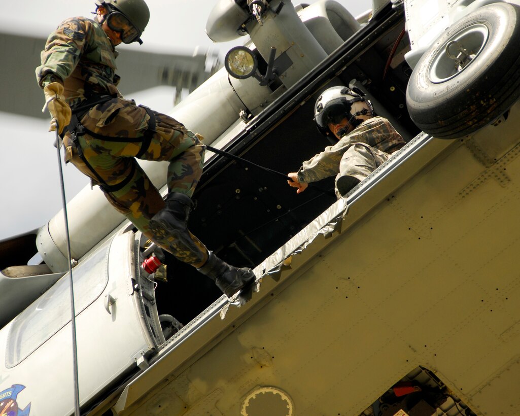 Senior Airman Franklin Rosas, a member of the 554th RED HORSE Squadron's Air Assault team, prepares to repel out of an HH60 helicopter. (U.S. Air Force photo/Airman 1st Class Daniel Owen)