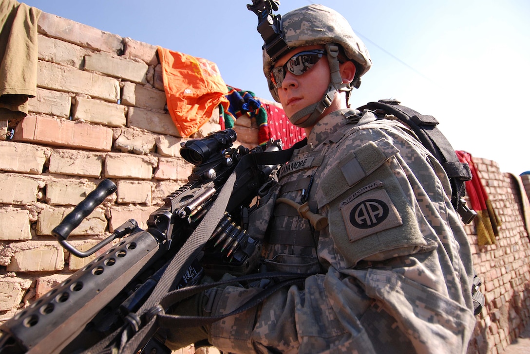 Pekin, Ill., native Army Pfc. Kyle Canamore, the newest member of the 82nd Airborne Division’s 2nd Platoon, Company B, 2nd Battalion, 325th Airborne Infantry Regiment, 2nd Brigade Combat Team, pulls security during a patrol through Baghdad’s Shaab neighborhood Jan 17, 2008. Photo by Staff Sgt. Mike Pryor, USA