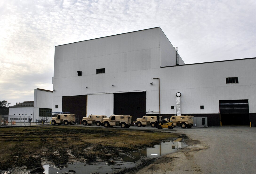 Mine Resistant Ambush Protected (MRAP) vehicles await completion