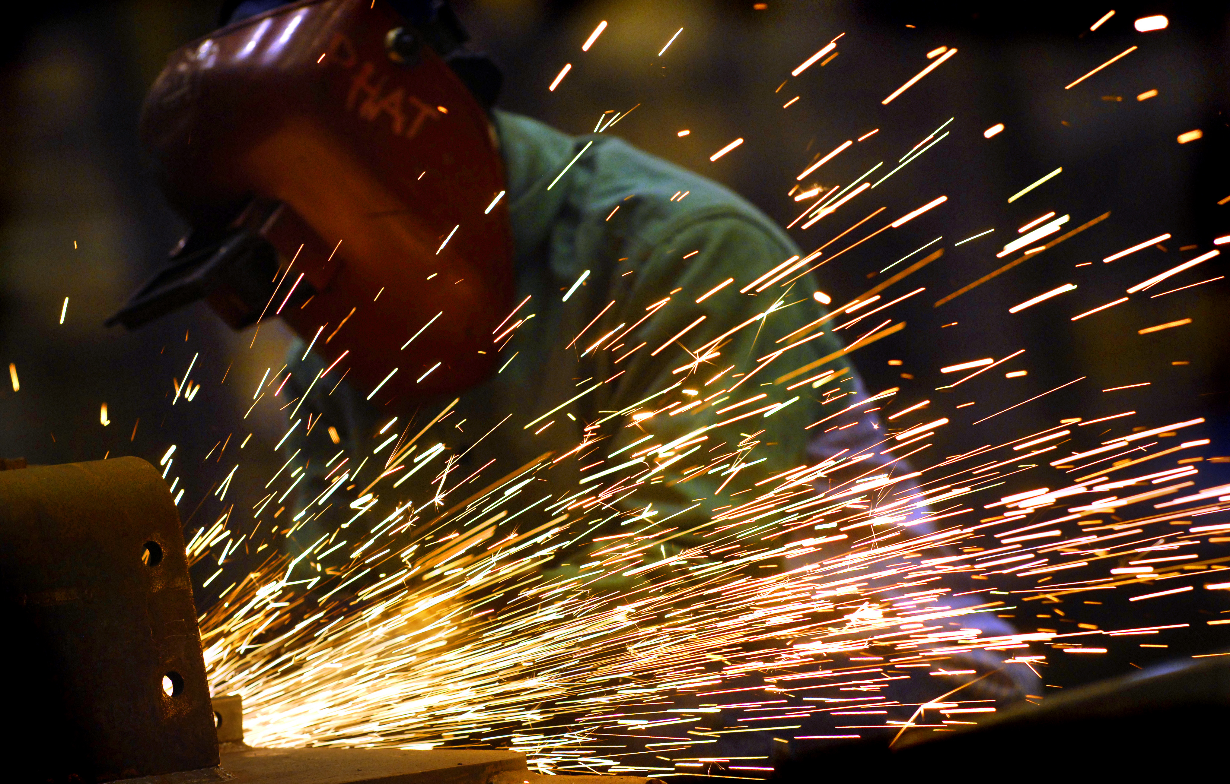 Workers at Force Protection Industries Inc. make Cougar H 4 X 4 MRAP