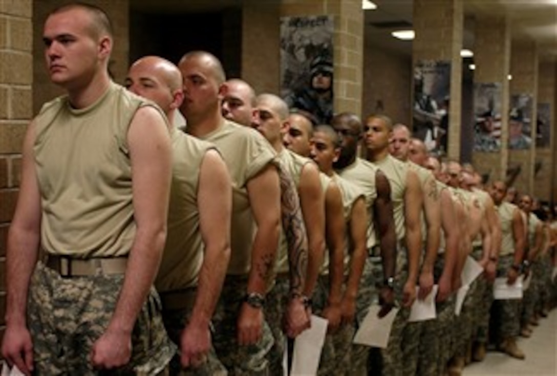 New soldiers in U.S. Army basic combat training roll up their sleeves in preparation for immunizations during  in-processing January 16, 2008 at Fort Jackson, S.C. 