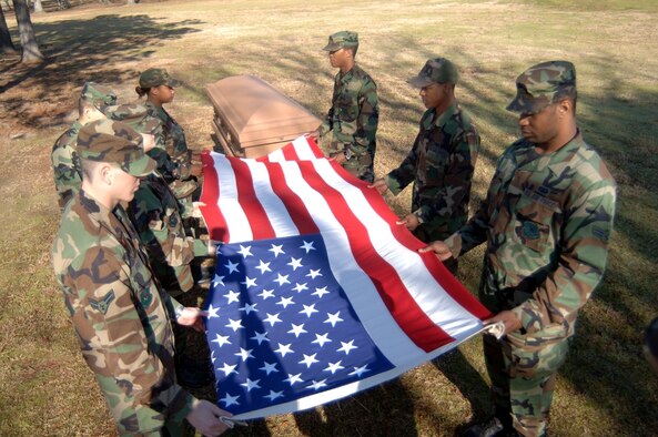 Members of the CAFB honor guard practice folding a flag during Honor Guard practice. For more information on joining the Honor Guard, call Master Sgt. John Berube at 434-7004. (U.S. Air Force photo by Senior Airman John Parie)
