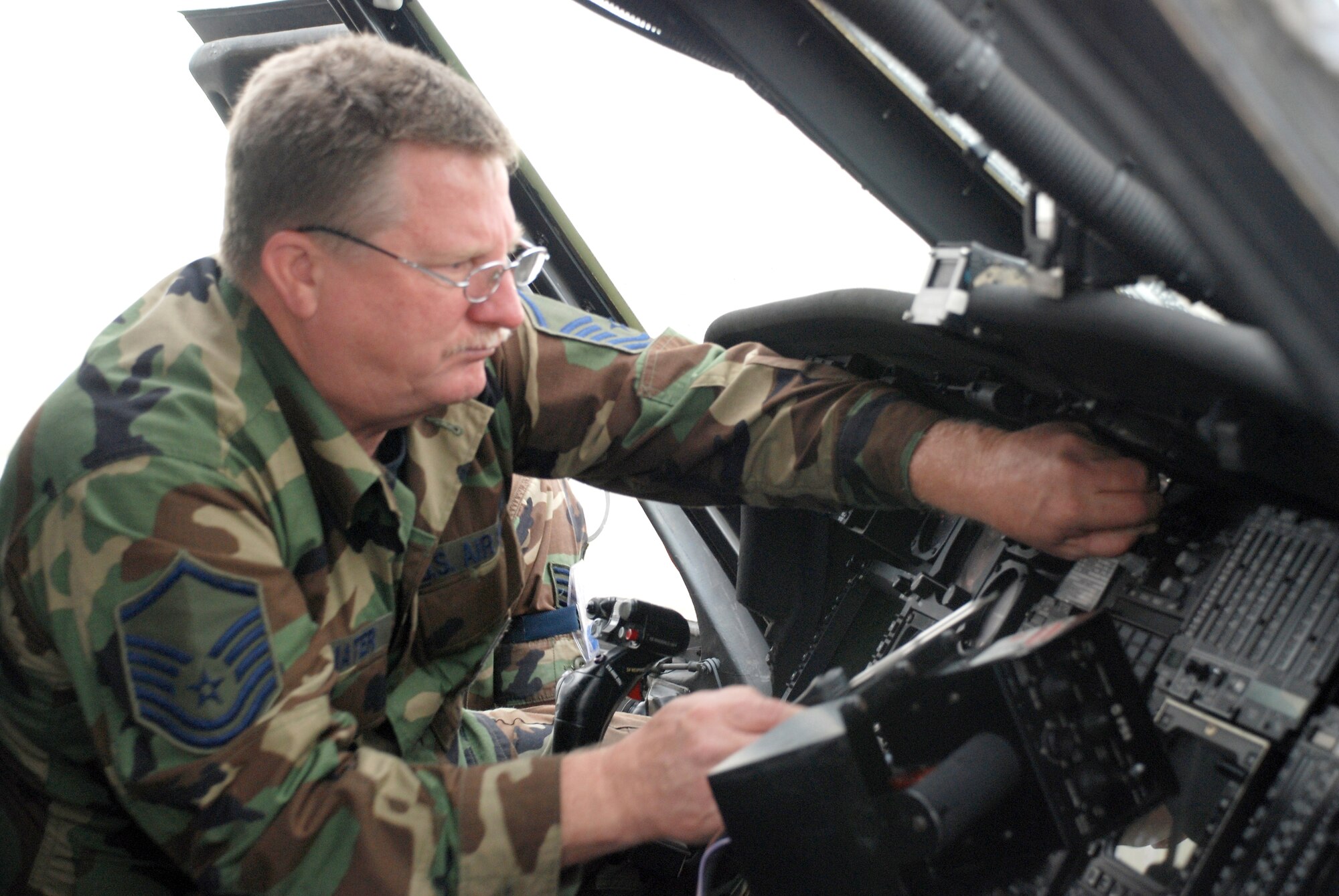 Air Force Reservist Master Sgt. Tom Trommater, 920th Maintenance Squadron, maintains the APR 39 Radar Warning Receiver and the AAR 47 missile approach warning system on an HH-60G Pave Hawk Helicopter during a Unit Training Assembly weekend at Patrick Air Force Base, Fla. (U.S. Air Force Photo/Master Sgt. Ray Padgett)