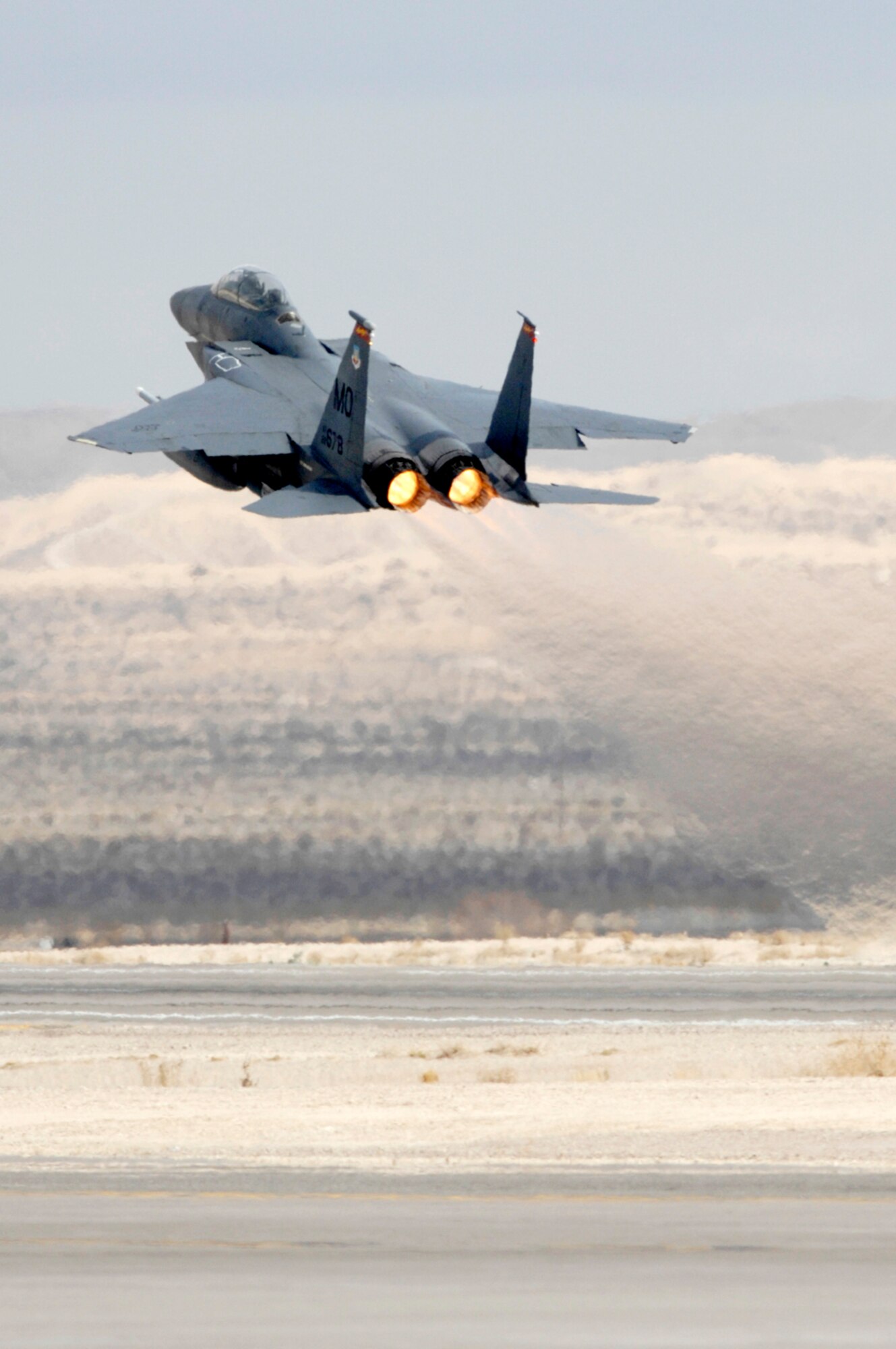 NELLIS AIR FORCE BASE, Nev.— An F-15E Strike Eagle from the 389th Fighter Squadron, Mountain Home AFB, Idaho, takes off for a mission during Red Flag 8-2.1 here Jan. 22. Red Flag is a multi-national exercise providing pilots with a realistic environment to practice combat scenarios. The experience gained during the exercise is vital to the survival of pilots in combat. (U.S. Air Force photo by Master Sgt Robert W. Valenca)